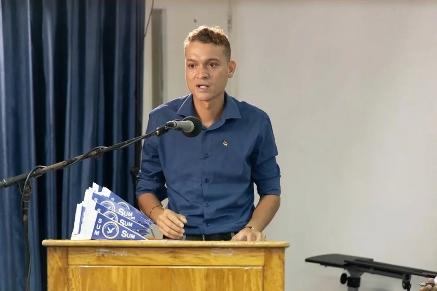 Salim Mathieu speaking at the podium of the Seychelles United Movement